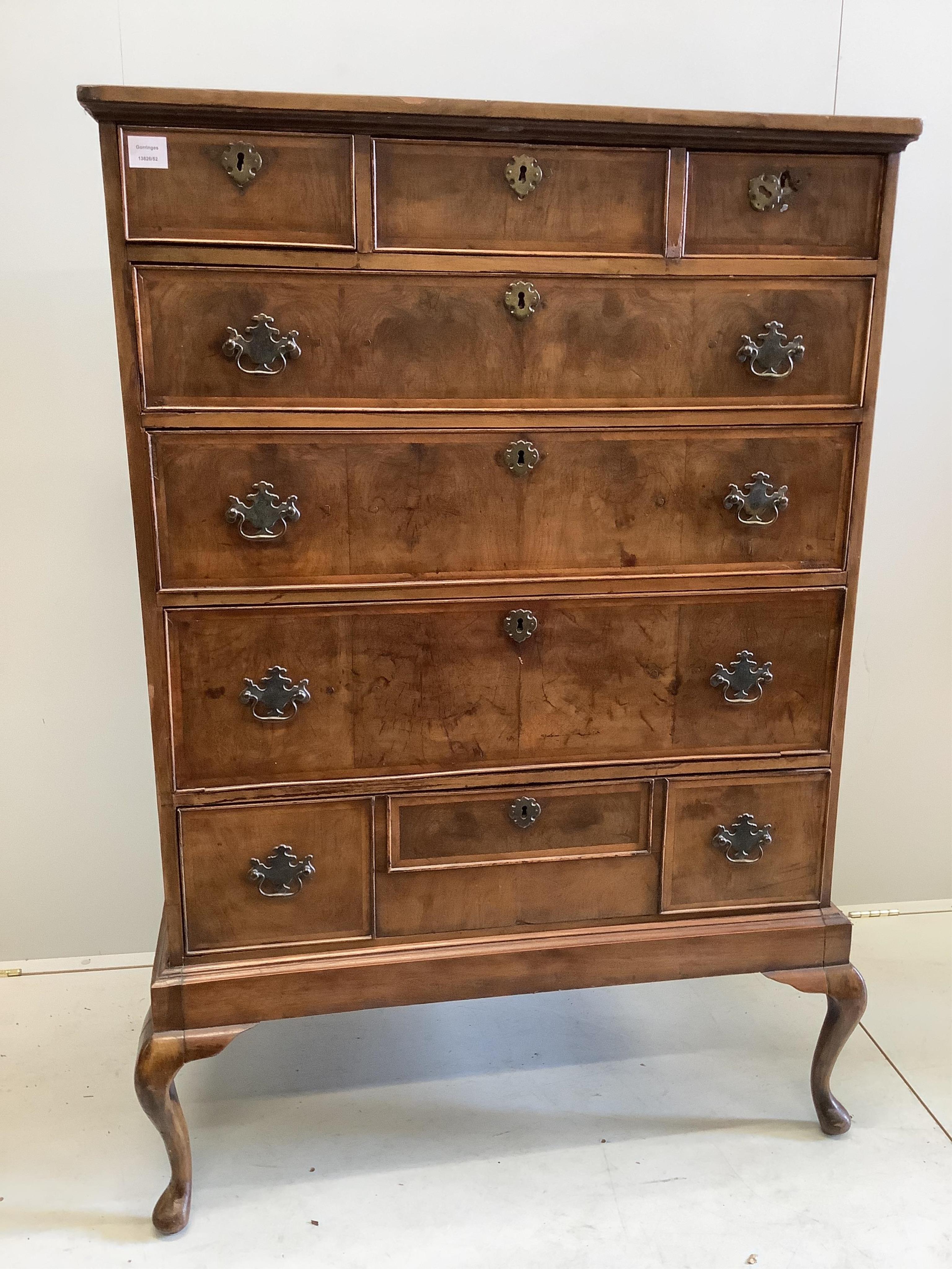 An 18th century and later feather-banded walnut chest on stand, width 96cm, depth 51cm, height 144cm